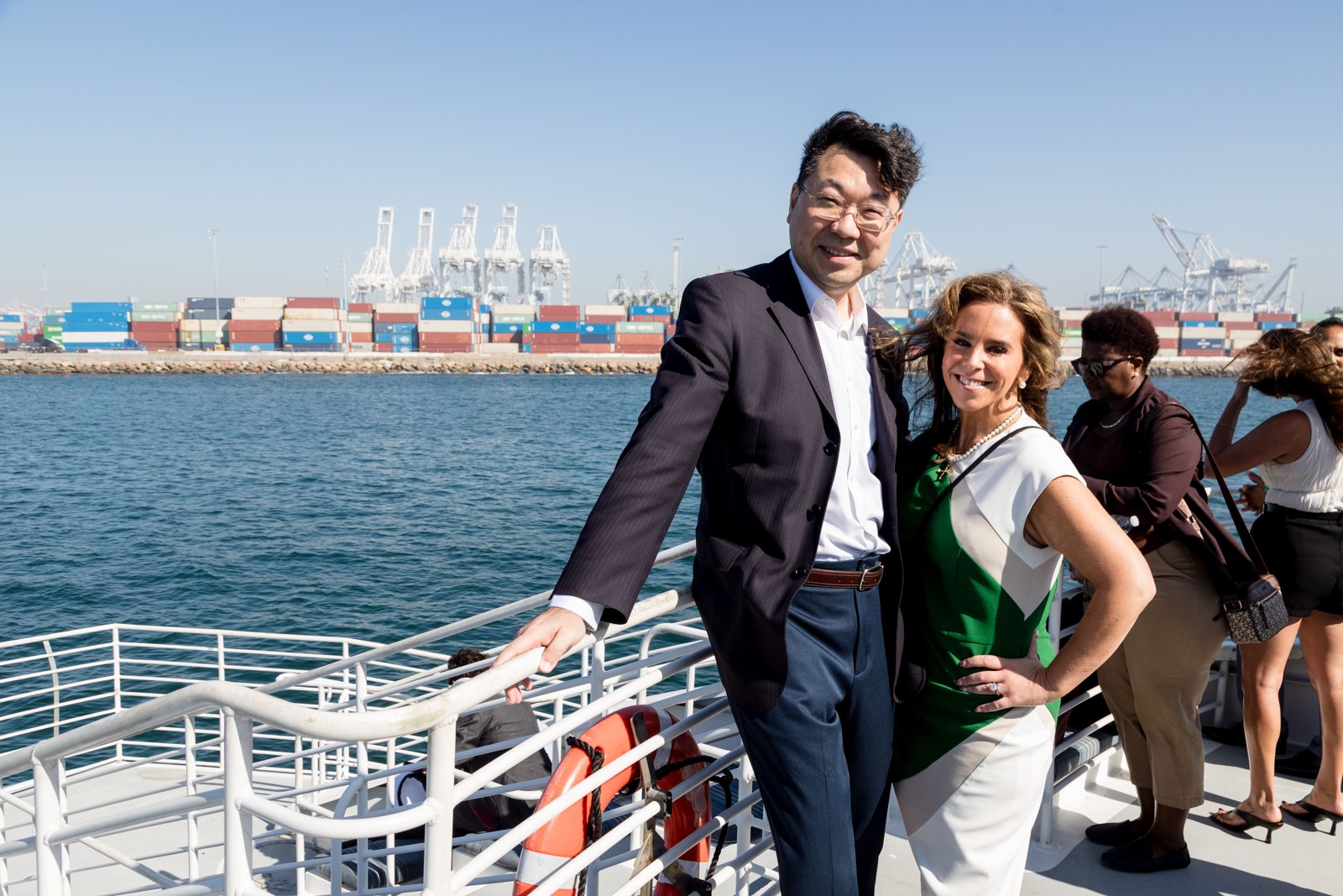 Attendees pose with the Port of Long Beach in the background